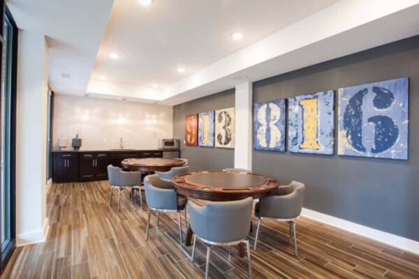 Prairie View at Village West apartments poker room with round poker tables.