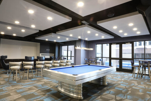 Forum Fitzsimons apartments lounge with pool table.