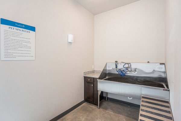 The Marc at Monument Ridge pet spa with metal wash tub.