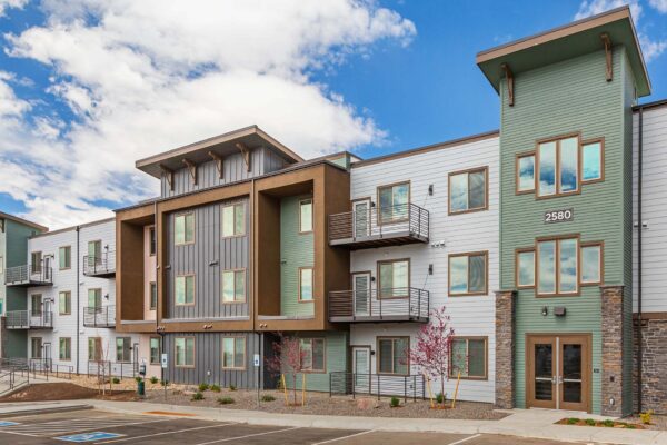 The Preserve at Mesa Creek exteriors with large balconies and rocky landscaping.