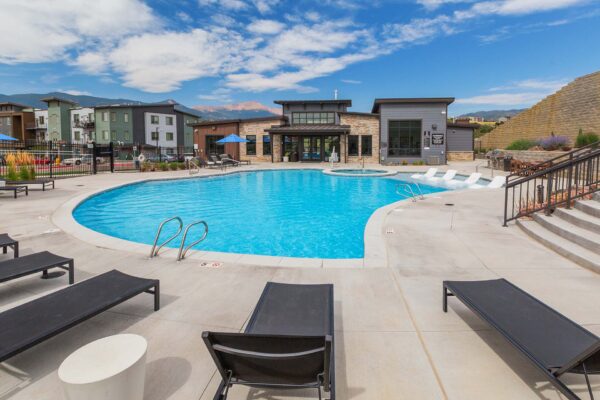 The Preserve at Mesa Creek pool area with lounge chairs.