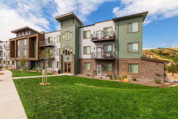 The Preserve at Mesa Creek exterior with lush grassy landscaping.