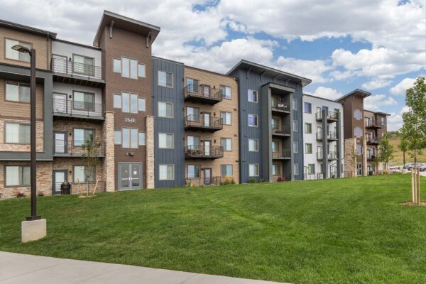 The Preserve at Mesa Creek exterior with lush grassy landscaping.