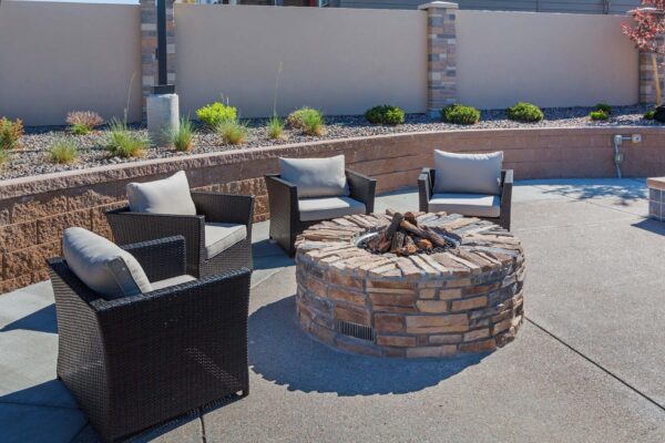 The Retreat at Patriot Park pool area with outdoor seating and fire pit.