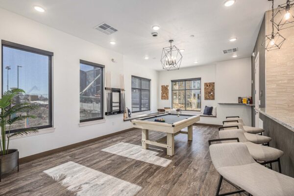 The Preserve at Mesa Creek game room with bar top, stools, and pool table.