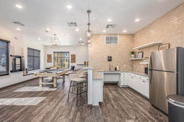 The Preserve at Mesa Creek game room with pool table and community bar.