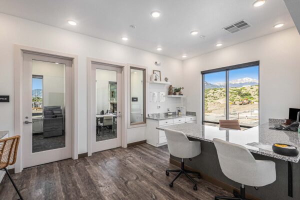 The Preserve at Mesa Creek leasing office with reception desk and leasing agent offices.