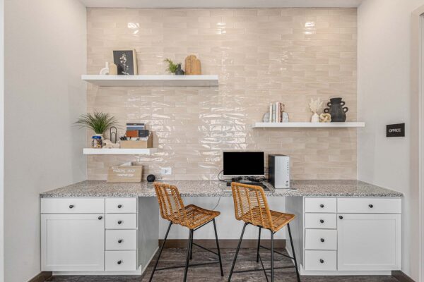 The Preserve at Mesa Creek leasing office with built in computer desk and chairs.