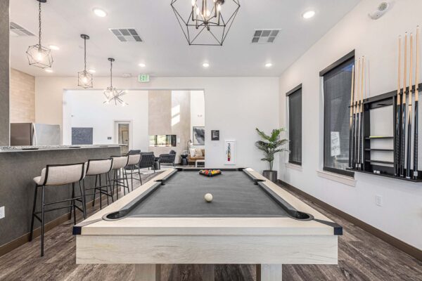 The Preserve at Mesa Creek game room with pool table and community bar.